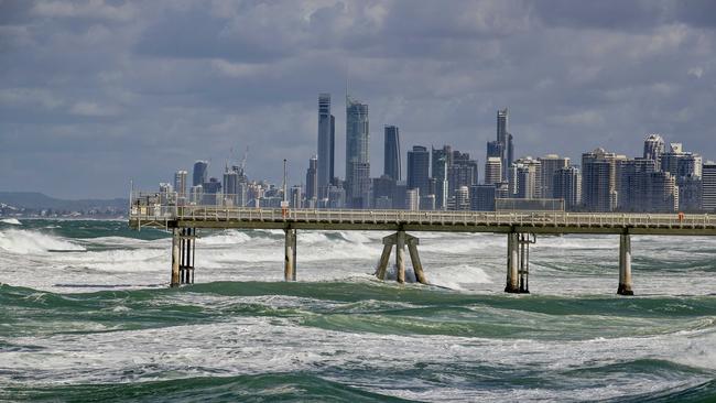 Strong wind and larger than normal seas with Surfers Paradise skyline in the background. Picture: Jerad Williams