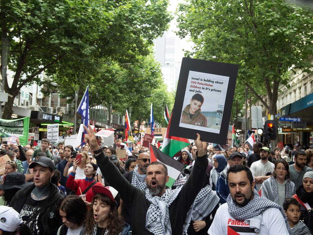 Protesters march down Swanston St in Melbourne. Picture: Nicki Connolly