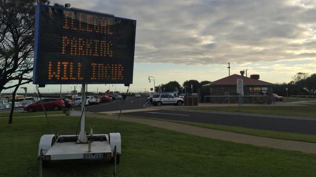 Signs at Peter Scullin Reserve warning about parking fines.