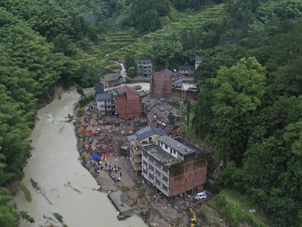 Rescuers search for victims of a landslide in eastern China's Zhejiang province. Picture: Chinatopix via AP