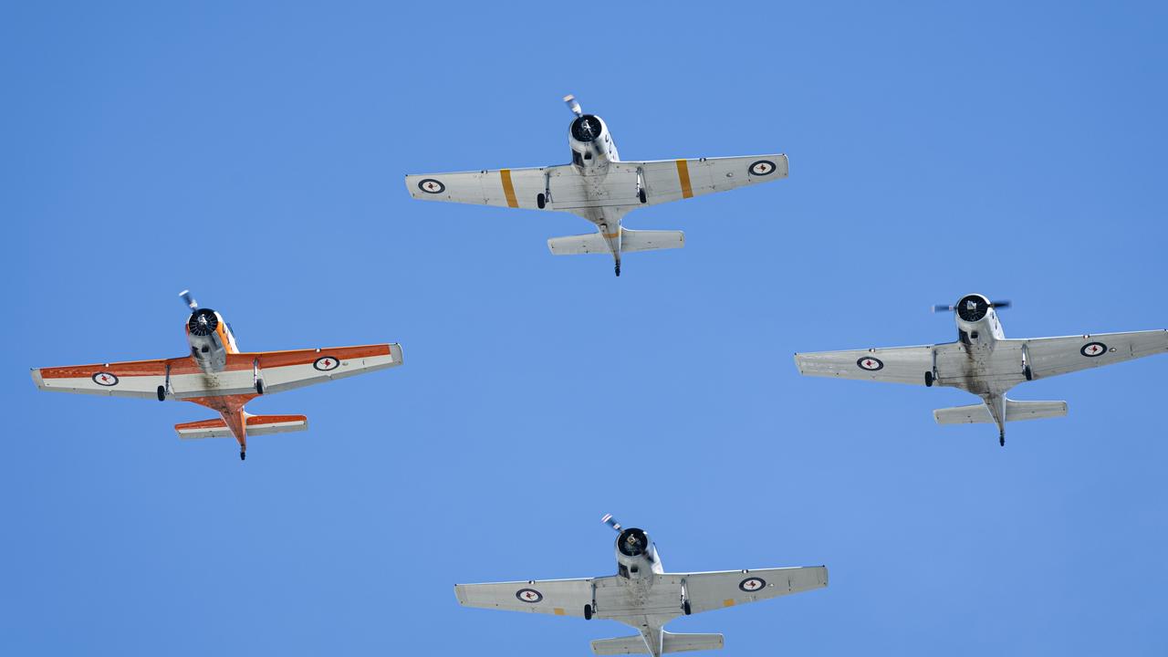 A squadron of CA-25 Winjeels fly-past over Toowoomba's Anzac Day mid-morning service at the Mothers' Memorial, Thursday, April 25, 2024. Picture: Kevin Farmer