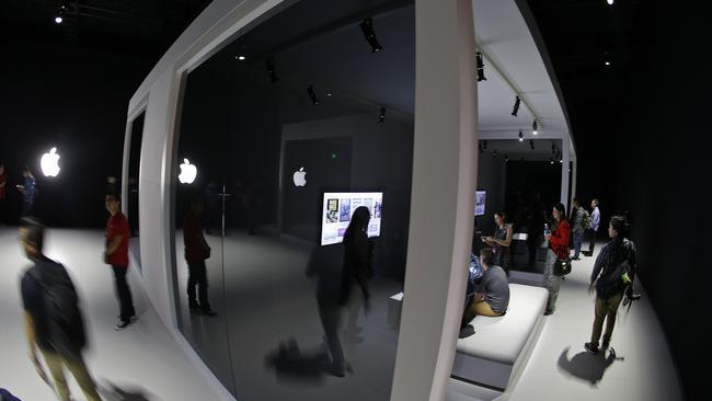 On show ... People walk through booths to experience the new Apple TV system during a product display following an Apple event Sept 9 in San Francisco. (AP Photo/Eric Risberg)