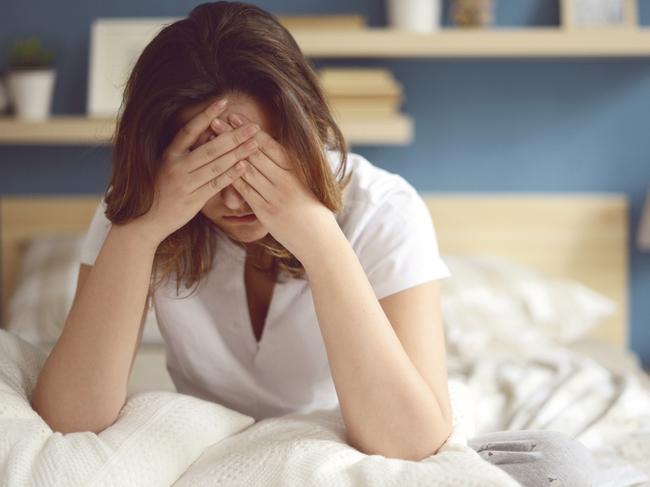 Unhappy girl in a bedroom - Stock image ipad generic