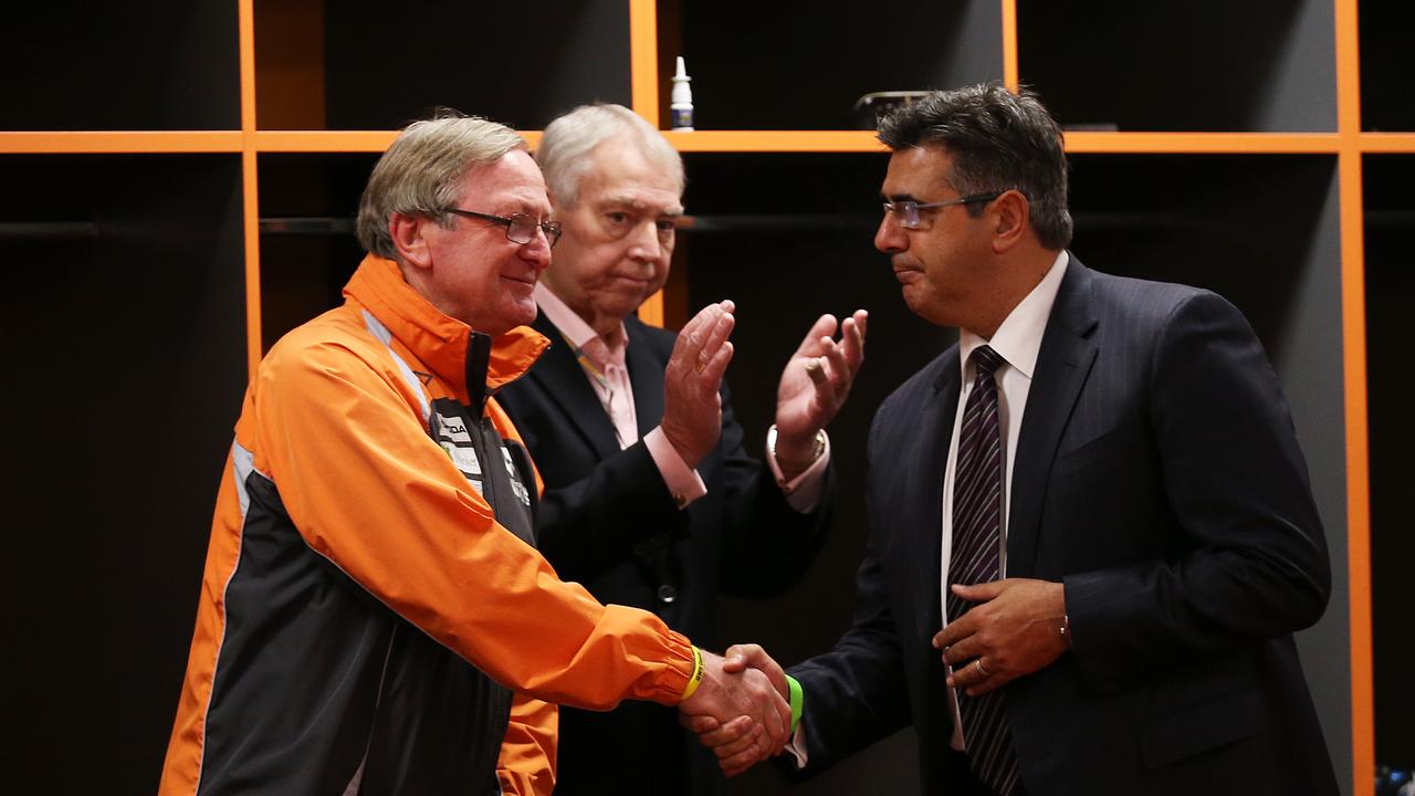 GWS Giants coach Kevin Sheedy is congratulated by AFL boss Andrew Demetriou in the rooms before his last home game as coach pic. Phil Hillyard