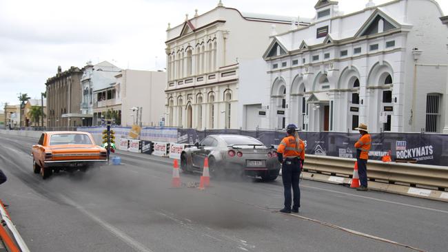 Shane Cattle launches off the line in his 440 big block Dodge hard top against a R35 Skyline GTR in the Rockynats street drags. Picture: Rodney Stevens