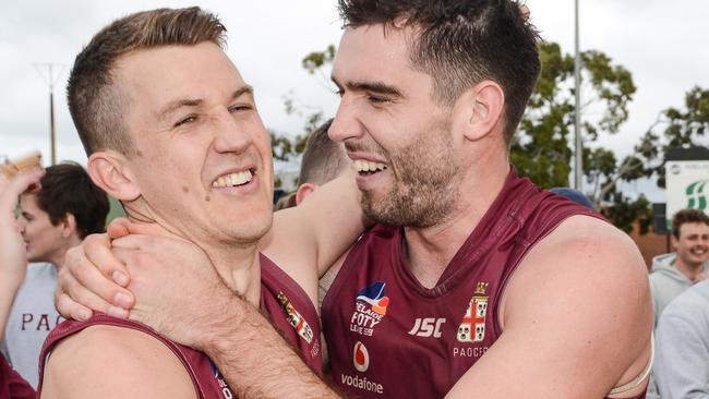 Jack Trengove and Cameron Giles celebrate after winning the Adelaide Footy League division one grand final between Prince Alfred Old Collegians and Payneham Norwood Union. They’ll be looking for a second straight flag this season. Picture: Brenton Edwards