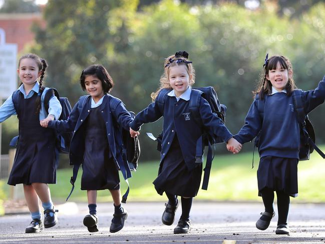 Vermont South's Holy Saviour Primary School prep students Zara, 5, Clare, 5, Mila, 5, Amelie, 6, Rachael, 6, all happy about returning to school. Picture: Alex Coppel.