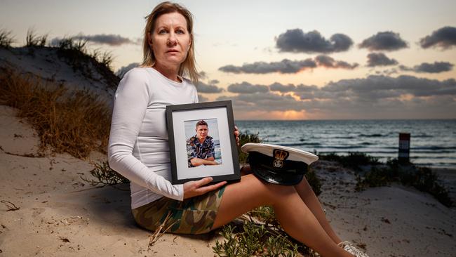 Julie-Ann Finney with a photograph and cap of her late son David at Tennyson Beach. Picture: Matt Turner