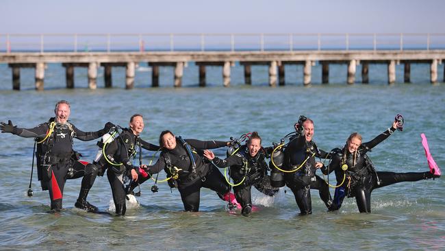 Divers Mark Schenk, Jessica Fitzgerald, Madi Anderson, Tessa Van Eekelen, Luke Ryan and Megan Beasley practice by the pier. Picture: Alex Coppel.