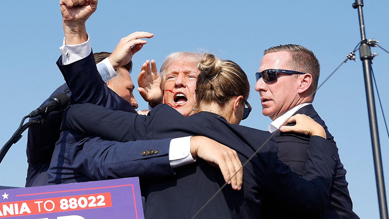 Mr Trump gestures to the crowd on his way off stage. Picture: Anna Moneymaker/Getty Images via AFP