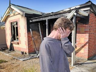 William Cluney in front of his burnt-out house at Murray Bridge. Picture: Mark Brake