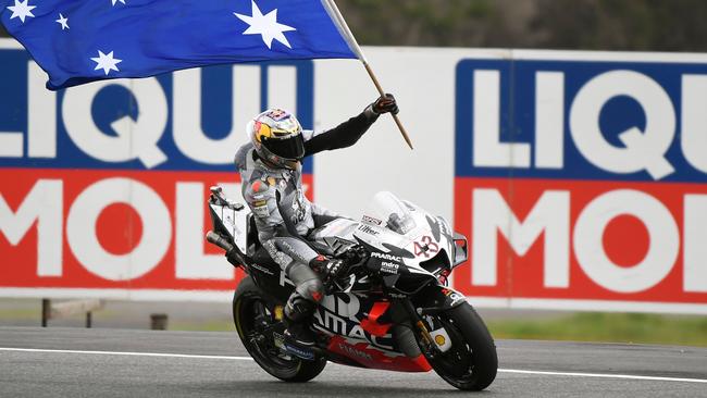 Miller celebrates third place in the Australian MotoGP race at Phillip Island last October.