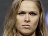 Ronda Rousey poses for photographers during a weigh-in for the UFC 175 mixed martial arts event at the Mandalay Bay, Friday, July 4, 2014, in Las Vegas. Rousey is scheduled to fight Alexis Davis in a women's bantamweight title fight on Saturday in Las Vegas. (AP Photo/John Locher)