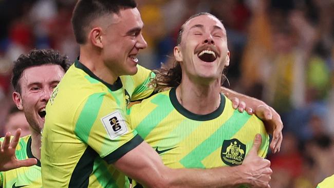 SYDNEY, AUSTRALIA - MARCH 20: Jackson Irvine of Australia celebrates scoring a goal with team mates during the round three FIFA 2026 World Cup AFC Asian Qualifier match between Australia Socceroos and Indonesia at Allianz Stadium on March 20, 2025 in Sydney, Australia. (Photo by Mark Metcalfe/Getty Images)