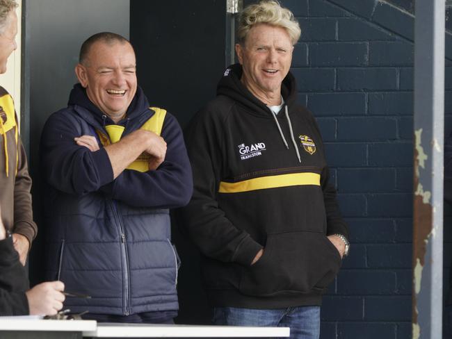 Somerville coach Jason Nagel shares a joke with footy legend and Heatherhill Fourth XI captain Dermott Brereton. Picture: Valeriu Campan