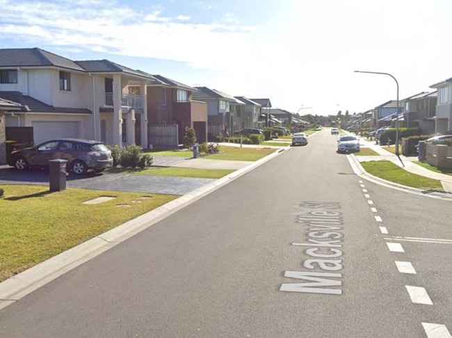 A 22-year-old woman was in her VW Golf on Macksville Street, Hoxton Park, when she was allegedly threatened by two people armed with a firearm and a knife who stole her car on November 23 2022