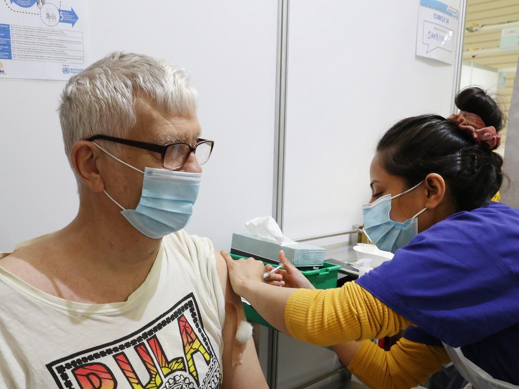 Terry Miles gets his vaccination at the Melbourne Showground. Picture: David Crosling