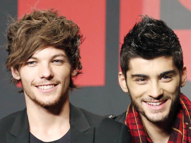 FILE - This Nov. 3, 2013 file photo shows One Direction members Louis Tomlinson, left, and Zayn Malik during an event for their film "One Direction: This Is US," in Makuhari, near Tokyo. One Direction fans have reacted with dismay to a report that band member Louis Tomlinson is to become a father. Publicist Simon Jones declined to comment Wednesday, July 15, 2015 on a People magazine report saying 23-year-old Tomlinson is expecting a child with American stylist Briana Jungwirth. (AP Photo/Koji Sasahara, File)