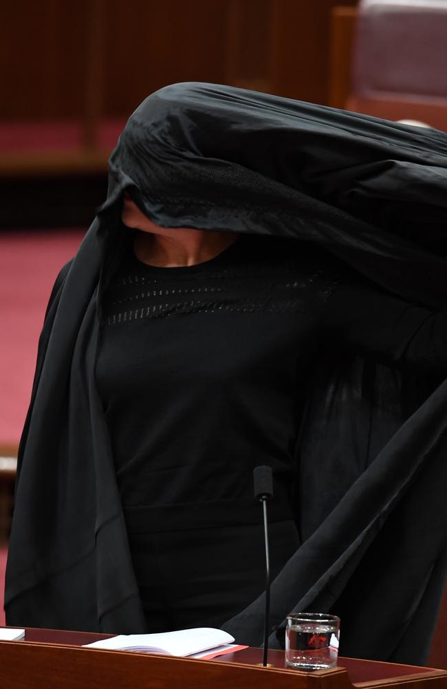 Senator Hanson still removing a burqa during Senate Question Time. Picture: AAP