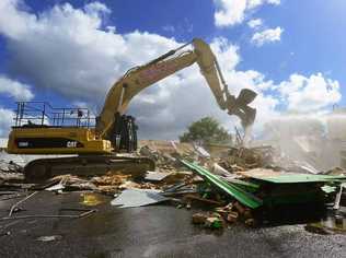 DOWN SHE GOES: Demolition has started on the One Mile Hotel but what exactly will be built on the site remains a mystery. Picture: DAVID NIELSEN