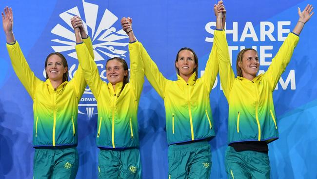 (L-R) Emily Seebohm, Georgia Bohl, Emma McKeon and Bronte Campbell of Australia during the medal ceremony for the Womens 4x100m Medley Relay Final on day six of swimming competition at the XXI Commonwealth Games at Gold Coast Aquatic Centre on the Gold Coast, Australia, Tuesday, April 10, 2018. (AAP Image/Darren England) NO ARCHVING, EDITORIAL USE ONLY