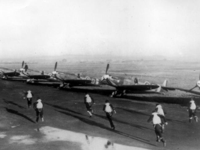 Pilots race to their Spitfires during the Battle of Britain. File picture