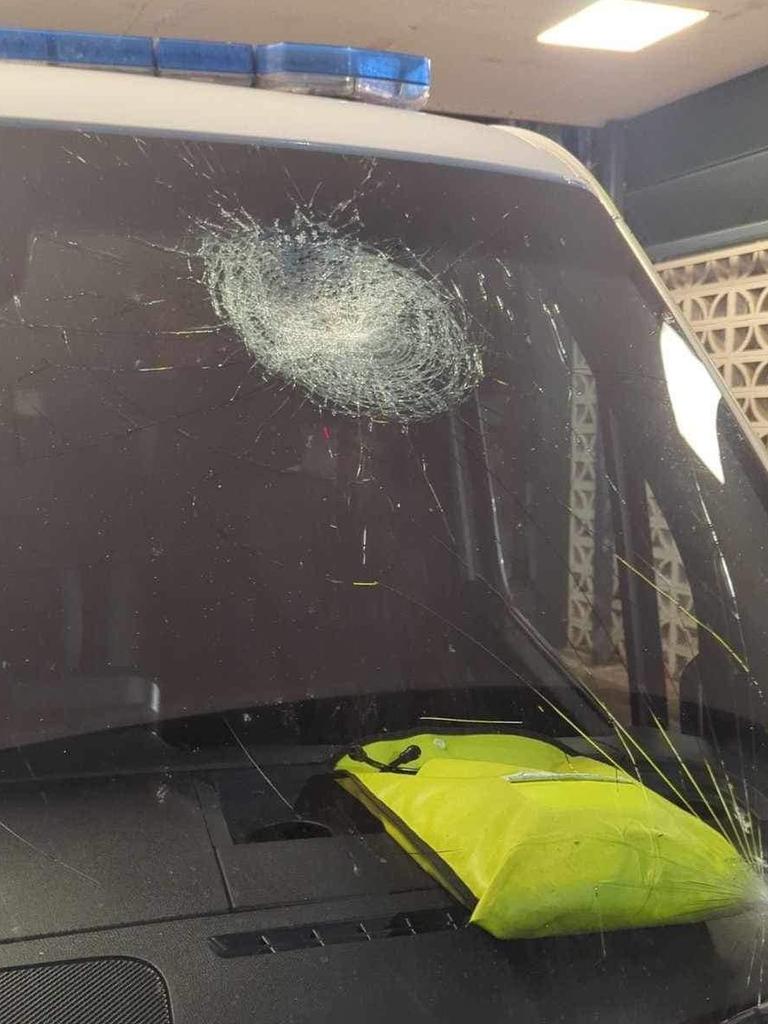 A paramedic was rushed to hospital after a group of children smashed an ambulance windshield, causing fragments of glass to strike their face and eyes. Picture: Facebook // Action for Alice