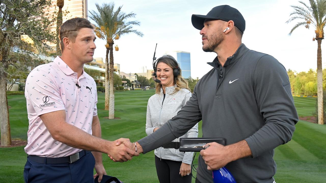 LAS VEGAS, NEVADA - NOVEMBER 26: Bryson DeChambeau (L) and Brooks Koepka shake hands after Koepka won their match during Capital One's The Match V: Bryson v Brooks at Wynn Golf Course on November 26, 2021 in Las Vegas, Nevada. (Photo by David Becker/Getty Images for The Match)