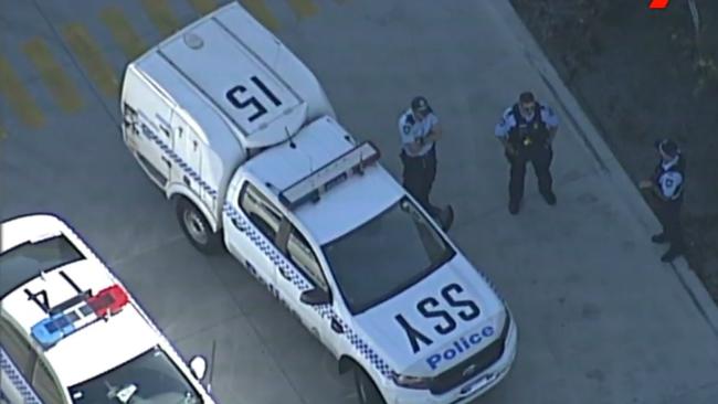 Police on the scene of a workplace stabbing at Alexandria this afternoon. Picture: 7 News