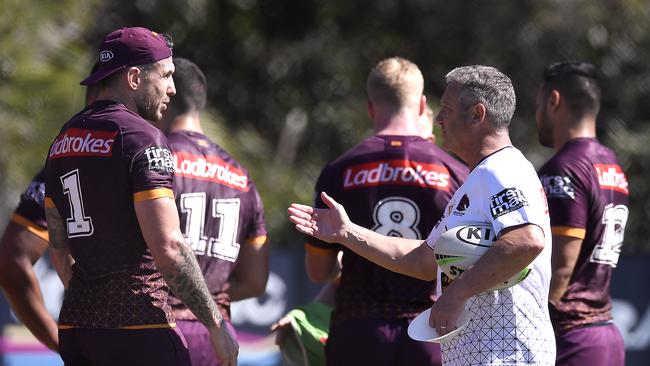 Veteran Broncos fullback Darius Boyd, left, speaks with stand-in coach Peter Gentle at training in Brisbane on Monday. Picture: Getty Images