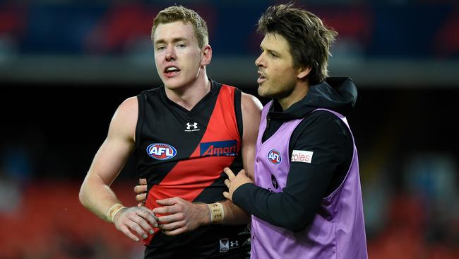 Jacob Townsend leaves the field after being collected by a Heath Shaw bump. Picture: Matt Roberts/AFL Photos/via Getty Images