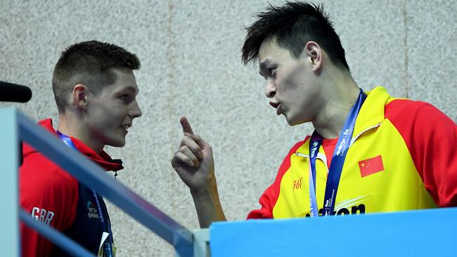 Sun Yang admonishes Duncan Scott for his podium protest.