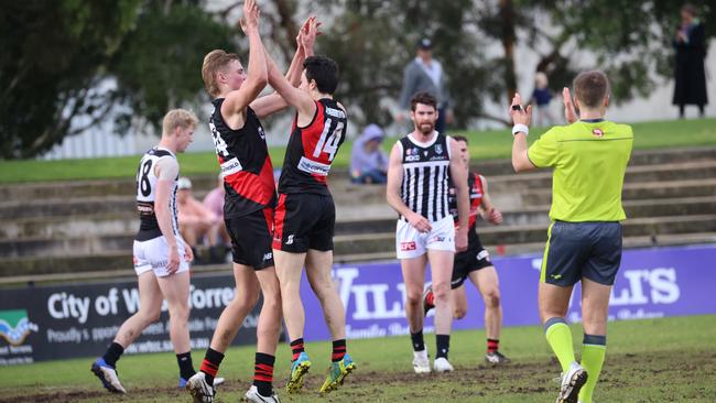 Harry Lemmey (left) celebrates a goal for West Adelaide with teammate Hugh Haysman in a league game against Port Adelaide earlier this year. Pictures: Russell Millard