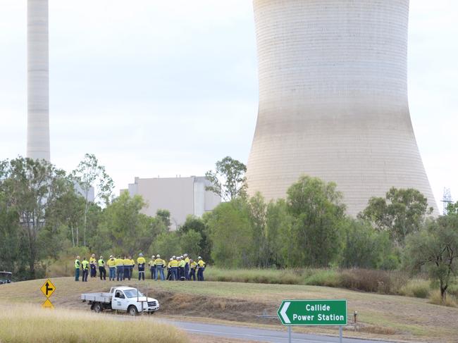 Workers from the Callide Power Station outside the site after a fire today. Photo - William Debois