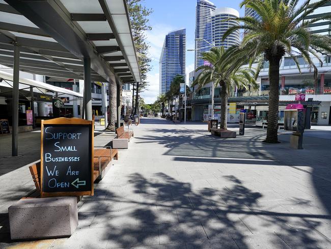 A deserted Cavill Avenue in April, 2020. The Covid pandemic threw small businesses into crisis, with many owners either sending workers home or closing as customers wane. Picture: AAP Image/Dave Hunt