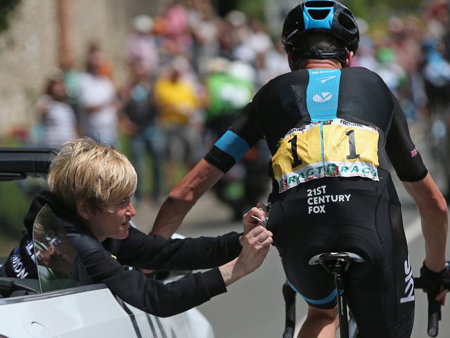 Chris Froome receives running repairs after his crash.