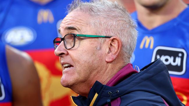 MELBOURNE, AUSTRALIA - APRIL 05: Chris Fagan, Senior Coach of the Lions speaks to his players during the round four AFL match between Richmond Tigers and Brisbane Lions at Melbourne Cricket Ground, on April 05, 2025, in Melbourne, Australia. (Photo by Josh Chadwick/AFL Photos/via Getty Images)