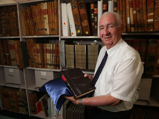 Premier Mike Ahern with original copy of the Fitzgerald Report he received from Tony Fitzgerald. Picture: AAP/Richard Waugh