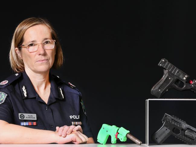 *DO NOT USE WITHOUT PERMISSION FROM RILEY WALTER** Assistant Commissioner Narelle Kameniar with seized 3D printed guns. 22 December 2023. Picture Dean Martin