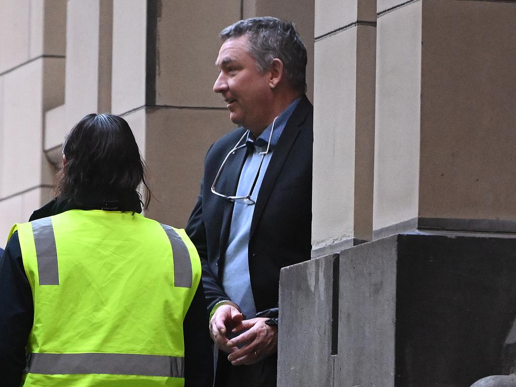 Greg Lynn is led out of court after an earlier hearing. Picture: Joel Carrett