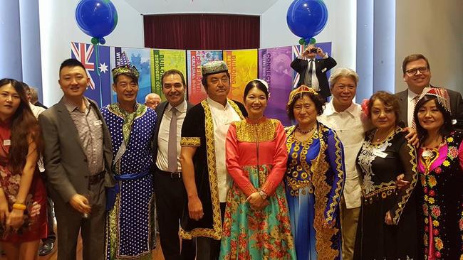 Jing Lee (red blouse, centre) poses with then-Opposition Leader, Premier Steven Marshall, and now-education minister John Gardiner at an SA Xinjiang Association function in November 2016.