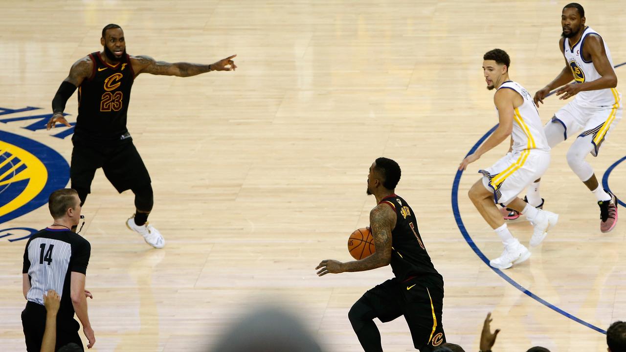 OAKLAND, CA - MAY 31: JR Smith #5 of the Cleveland Cavaliers dribbles in the closing seconds of regulation as LeBron James #23 attempts direct the offense against the Golden State Warriors in Game 1 of the 2018 NBA Finals at ORACLE Arena on May 31, 2018 in Oakland, California. NOTE TO USER: User expressly acknowledges and agrees that, by downloading and or using this photograph, User is consenting to the terms and conditions of the Getty Images License Agreement. Lachlan Cunningham/Getty Images/AFP == FOR NEWSPAPERS, INTERNET, TELCOS &amp; TELEVISION USE ONLY ==