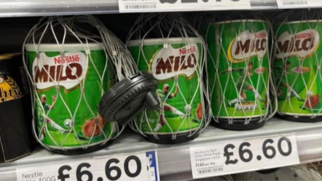 Tins of Milo have been locked away with security tags. Picture: Angela Beckett/news.com.au