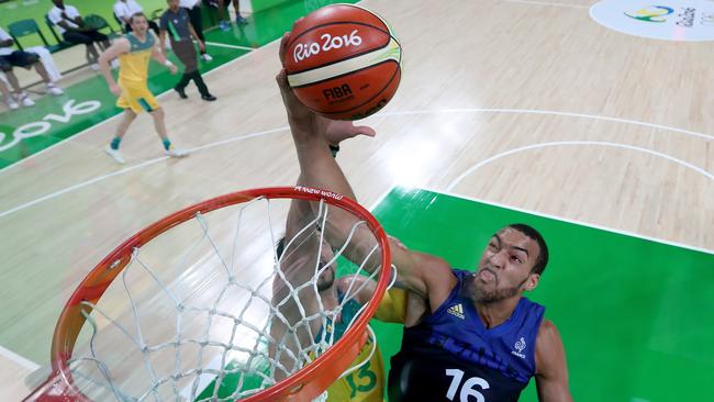 France’s Rudy Gobert grabs a rebound alongside Australia’s David Andersen.