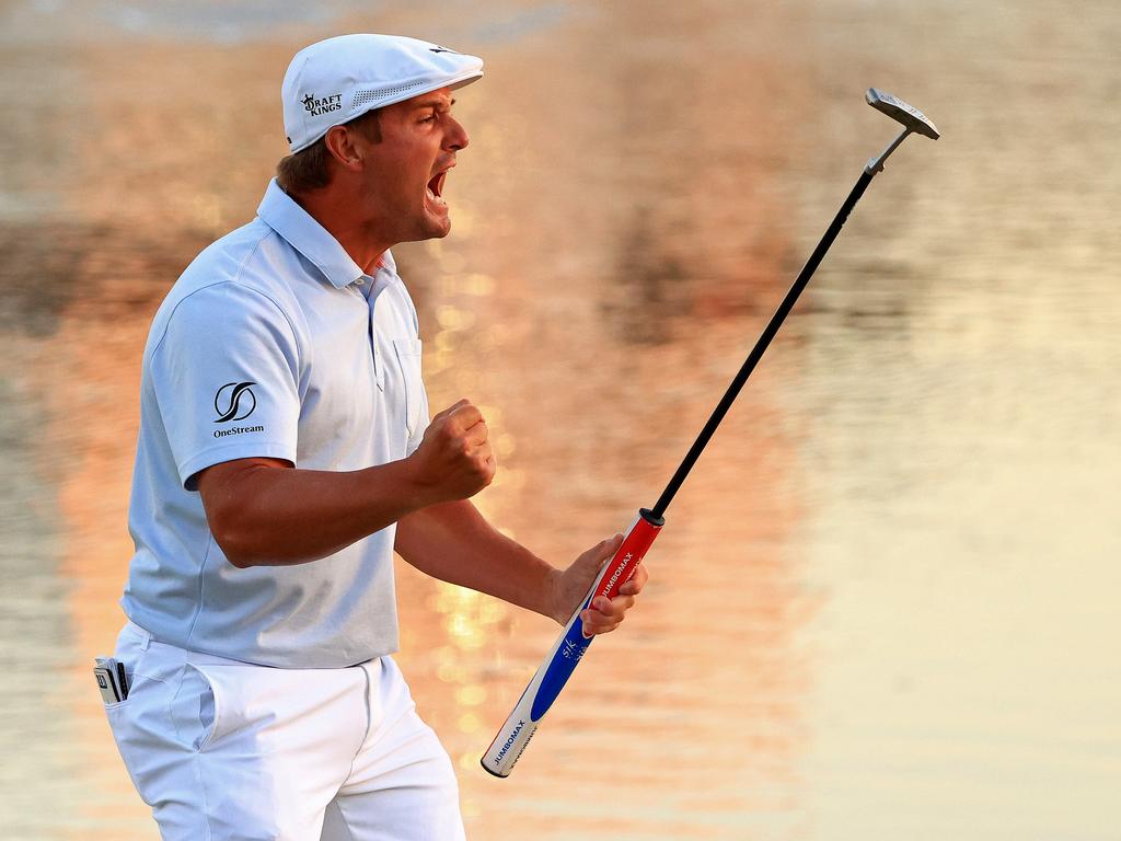 Bryson DeChambeau celebrates making his putt on the 18th green to win during the final round of the Arnold Palmer Invitational. (Photo by Mike Ehrmann/Getty Images)