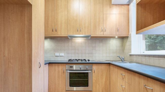 The '70s kitchen cupboards were showing their age before a clever and affordable refresh.