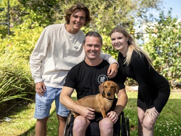 Dad of two Mick Chisholm became a paraplegic after a motocross accident.