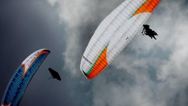 Crowds gather at Mt Tamborine to watch the paragliders. Picture: Luke Marsden.