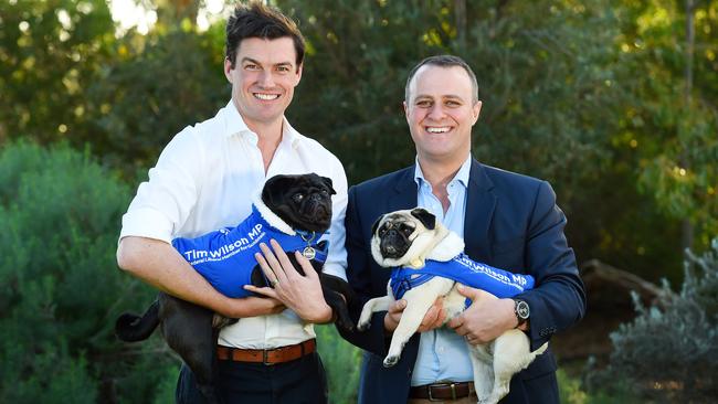 Tim Wilson, Liberal MP for Goldstein, right, with partner Ryan and pugs Ella and Louis. Picture: Josie Hayden