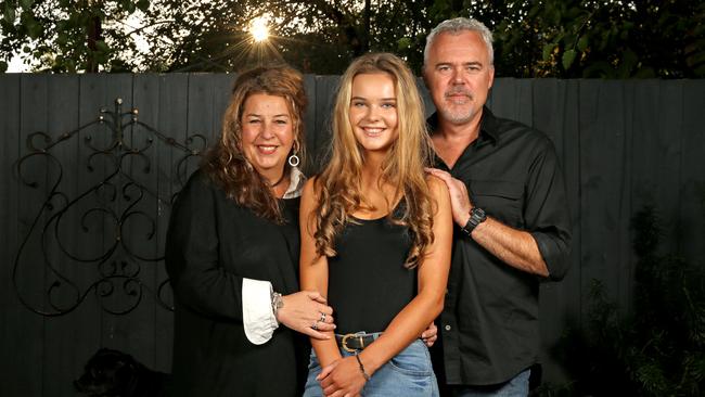 Sally Brownbill, Martin Stevens with daughter Lily, 15, held a successful 15th birthday party with the help of hired security. Picture: Tim Carrafa